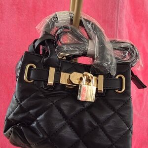 STUDIO BADLEY MISCHKA MINI DIAMOND QUILTED TOTE WITH FRONT LOCK. COLOR IS BLACK